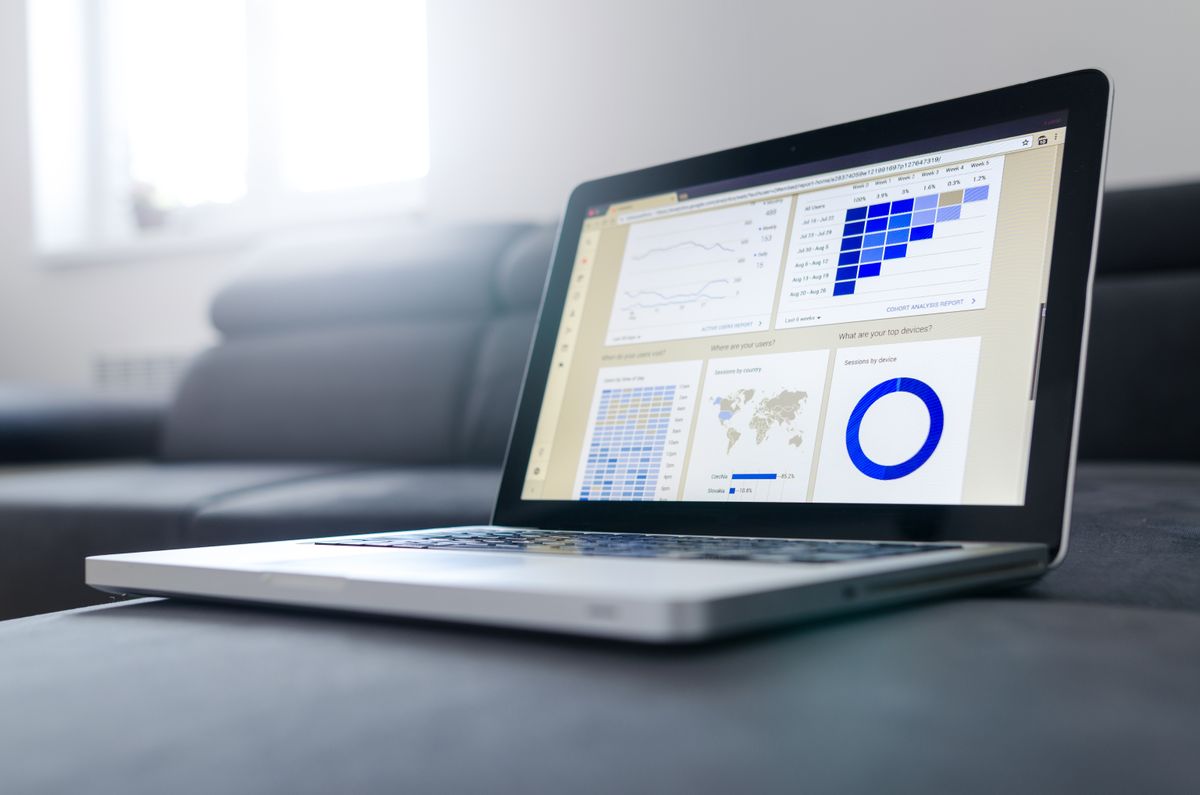 Laptop screen showing an analytics dashboard with traffic charts