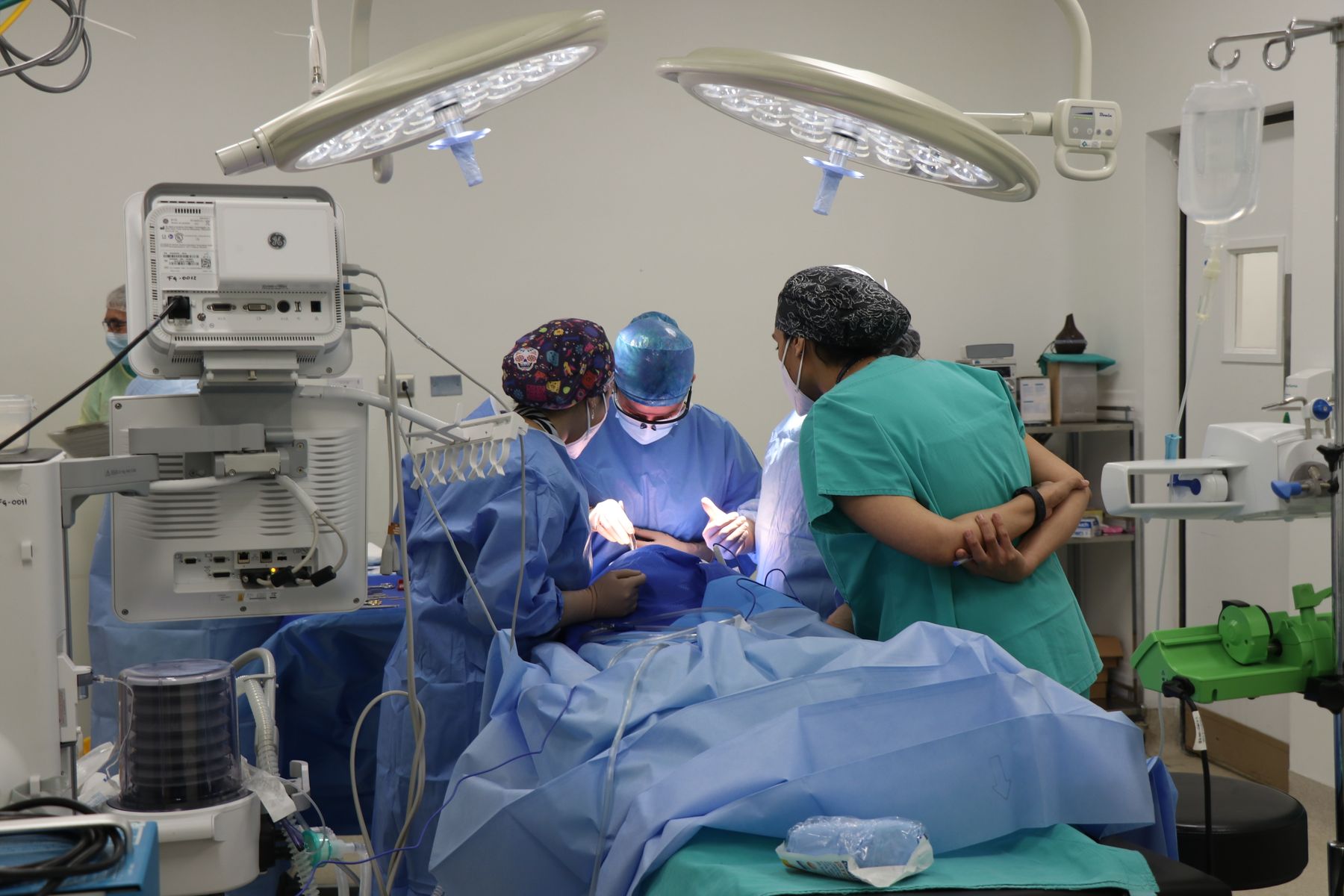 A team of surgeons performing a bariatric procedure in an operating room