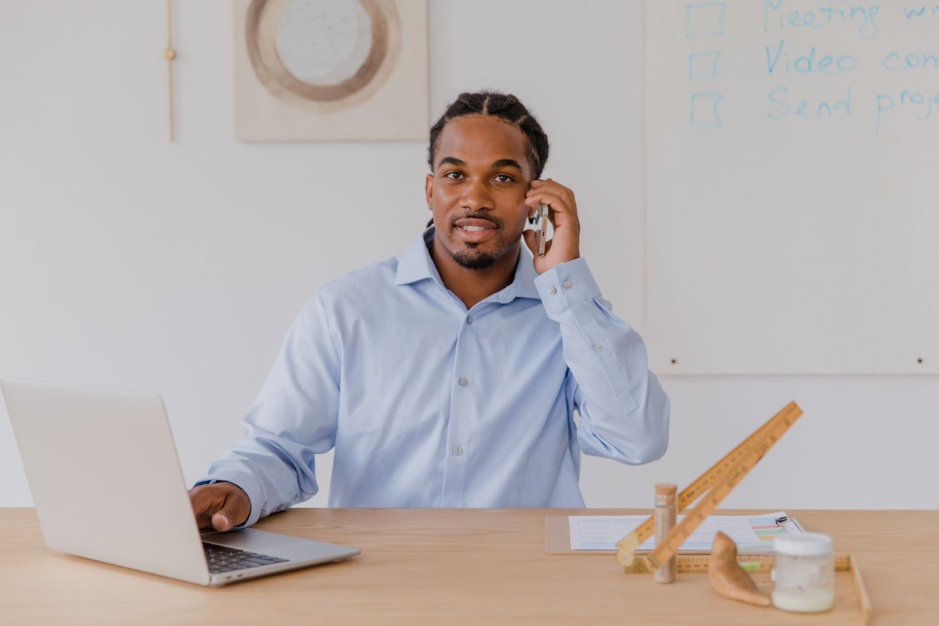 Business owner reviewing marketing numbers on a laptop at a desk