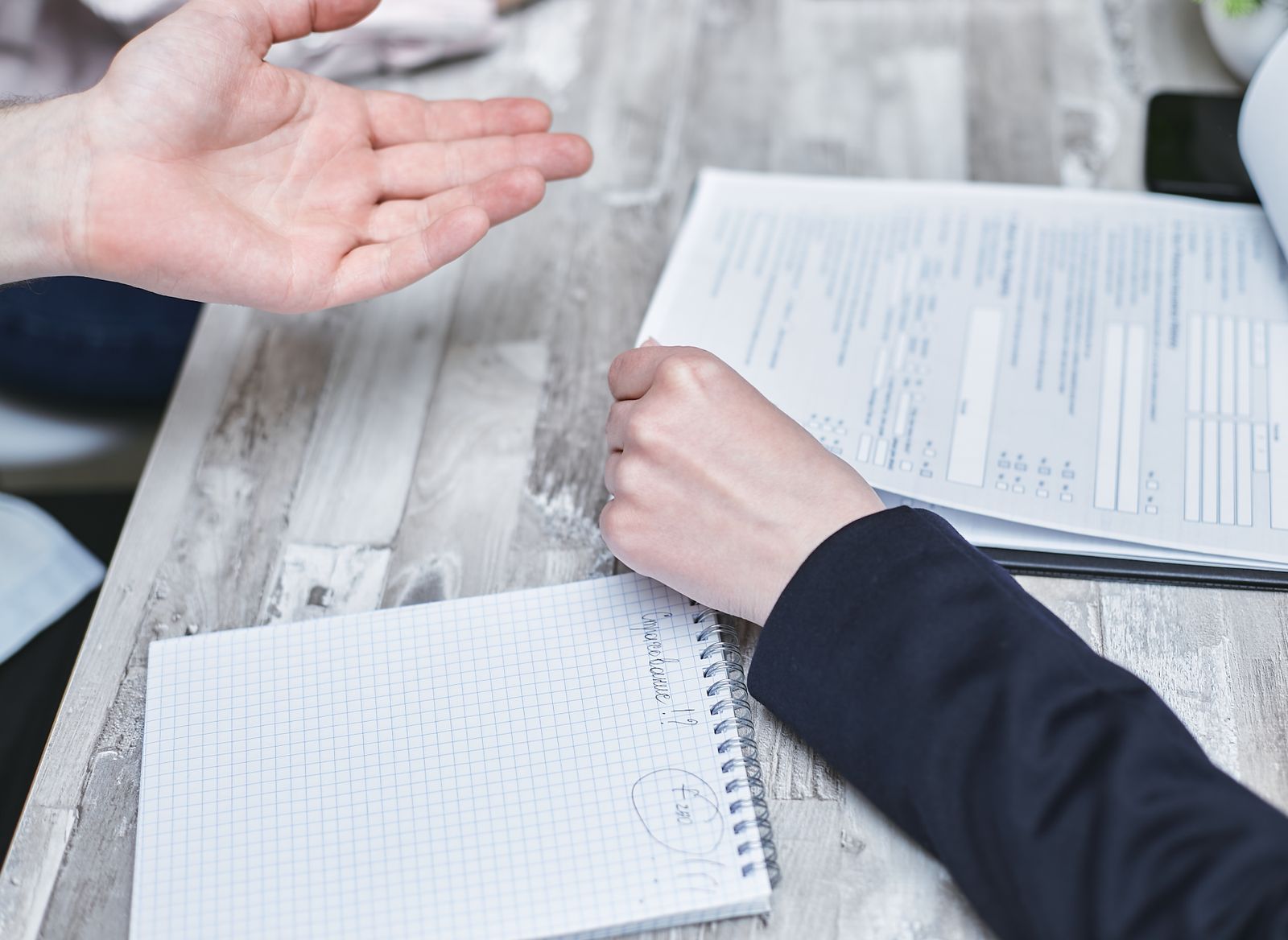 Two professionals reviewing legal documents during a case consultation