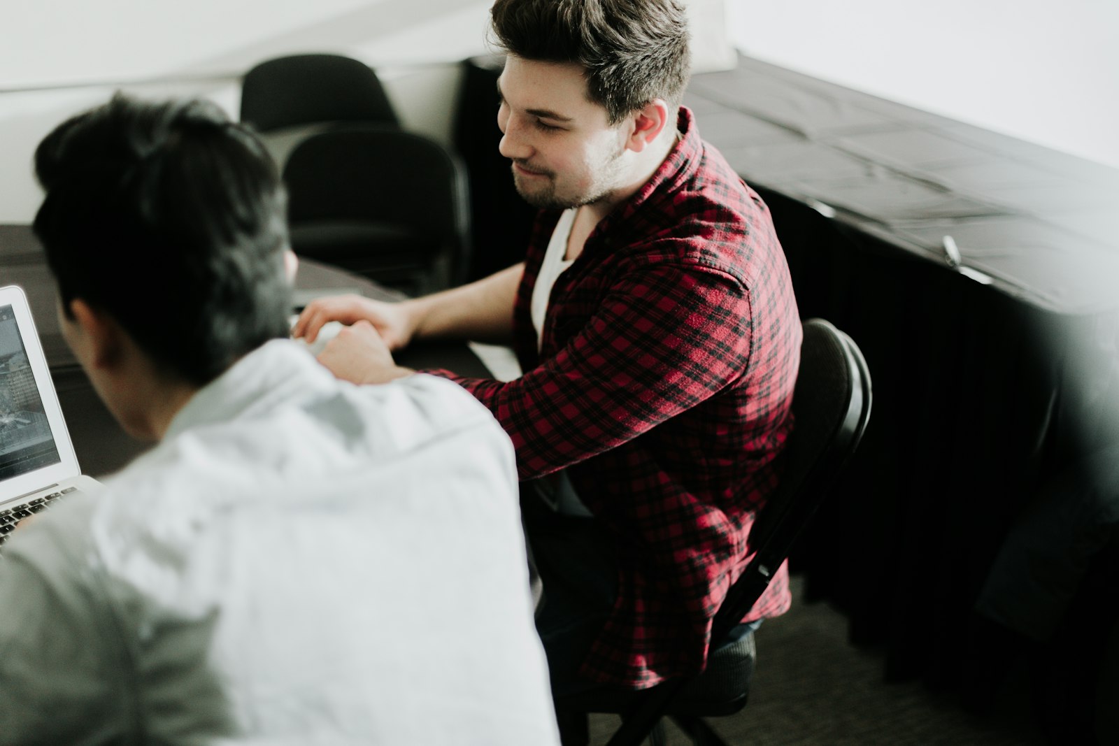 Business owner shaking hands with an IT support provider after a consultation