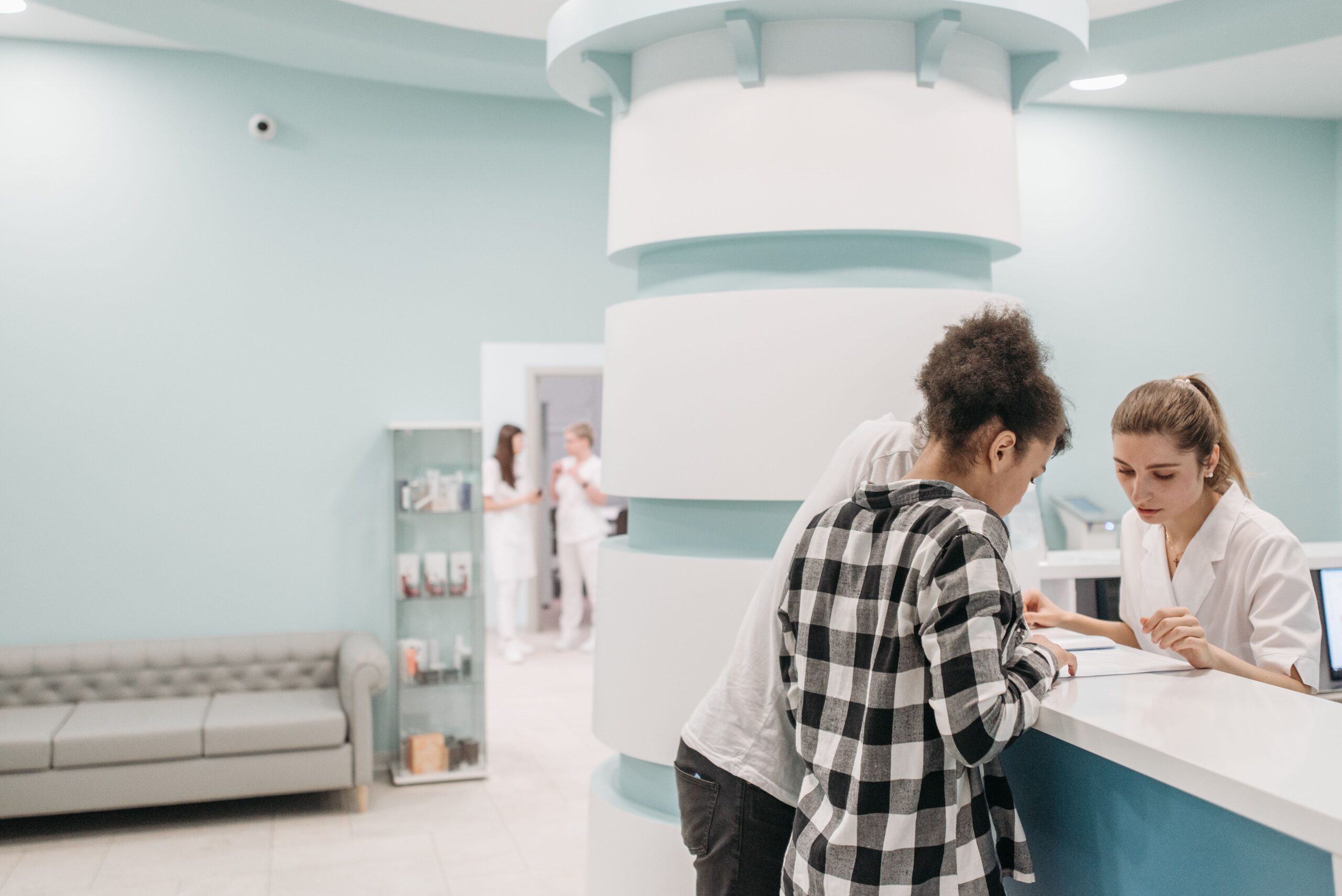 Reception desk at a modern medical clinic greeting patients