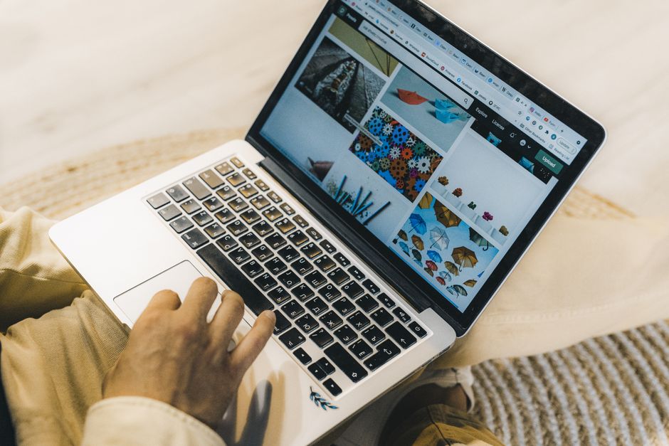 Person searching Google on a laptop to find a local business