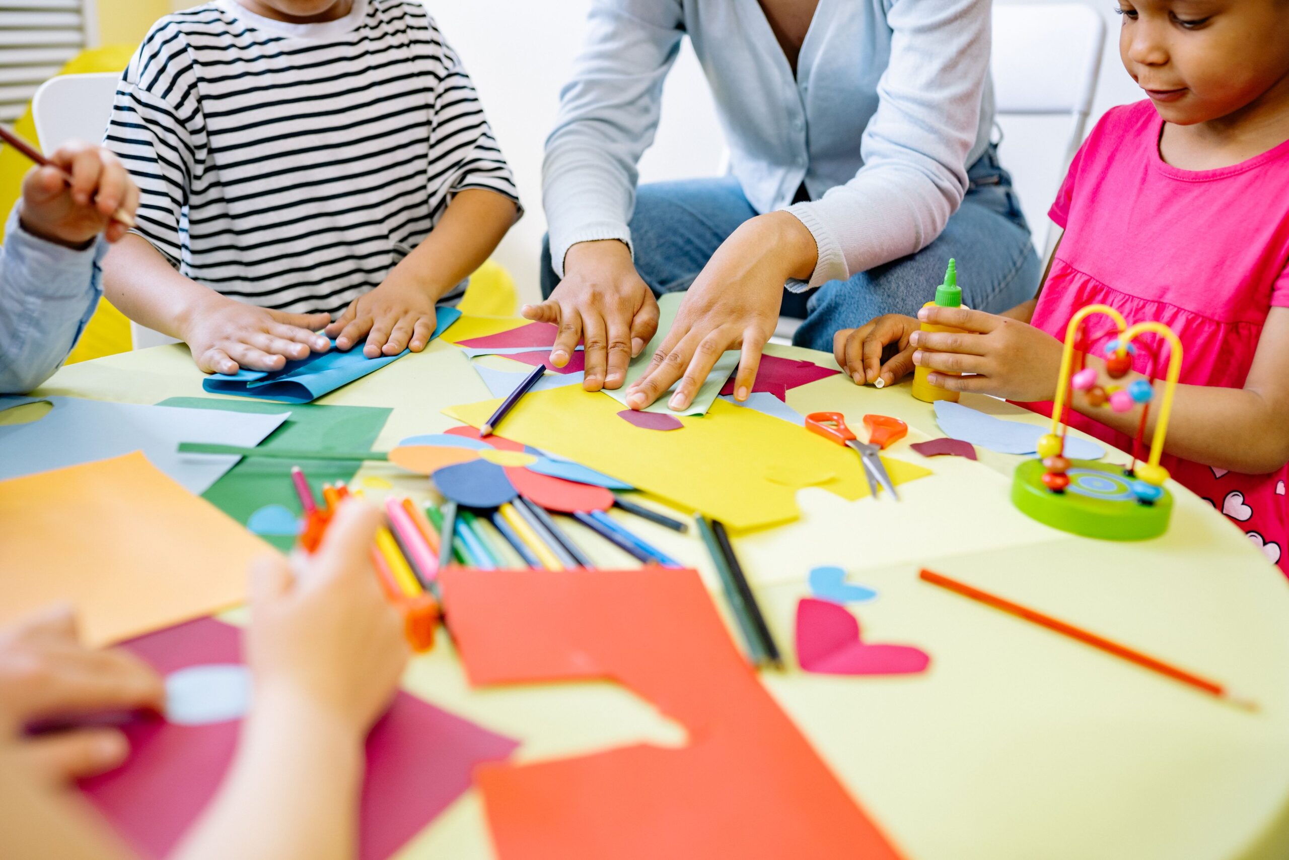 Diverse group of preschool children enjoying a creative art activity in a vibrant classroom