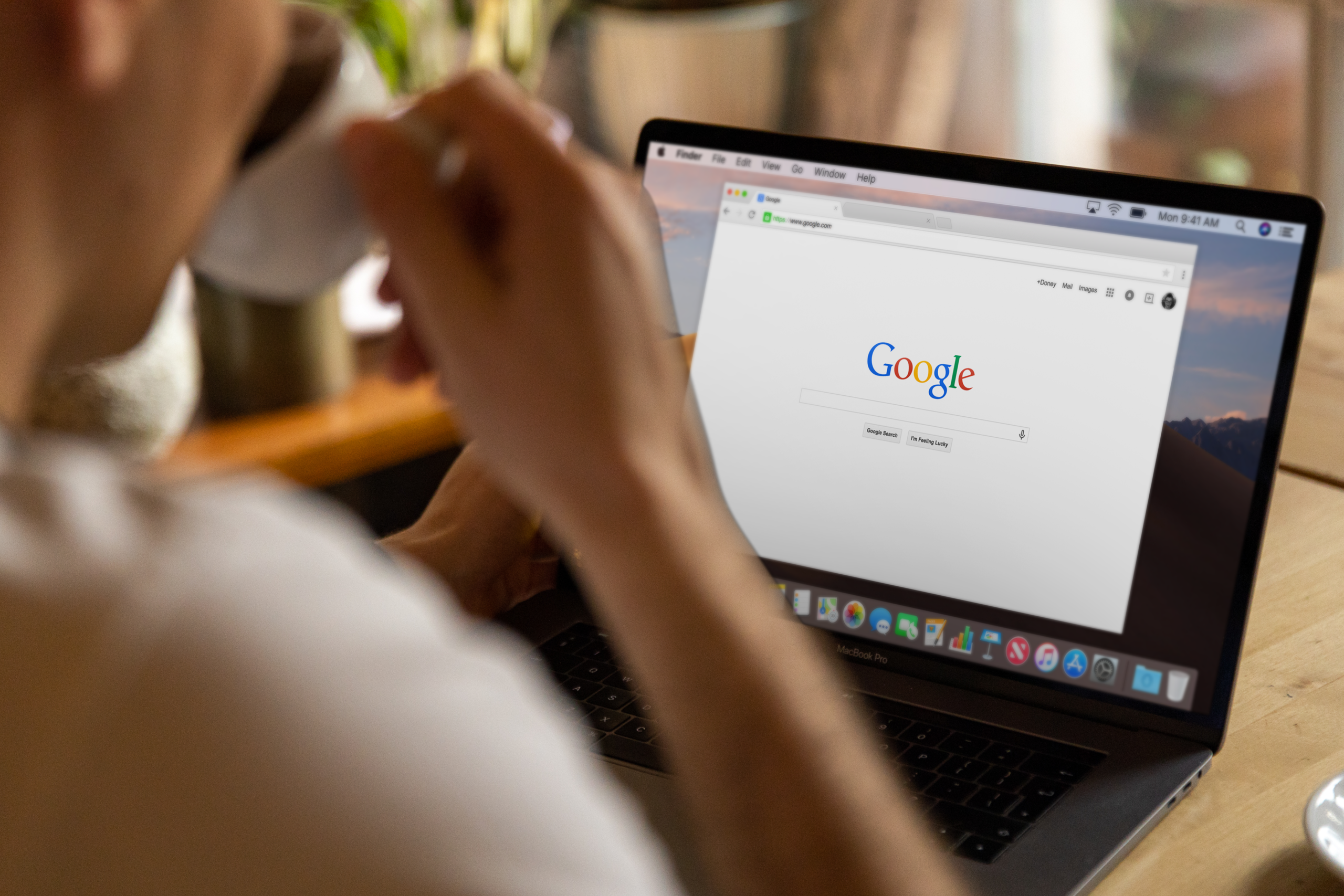 Person searching Google on a laptop for a local weight loss clinic