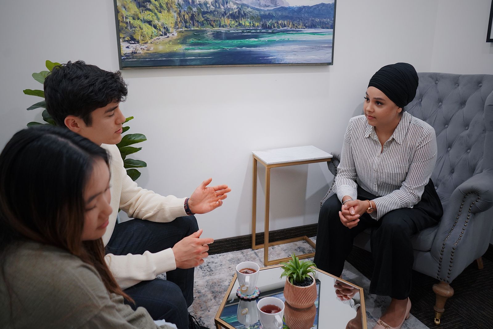 Intake counselor talking through options with a family in a treatment center office