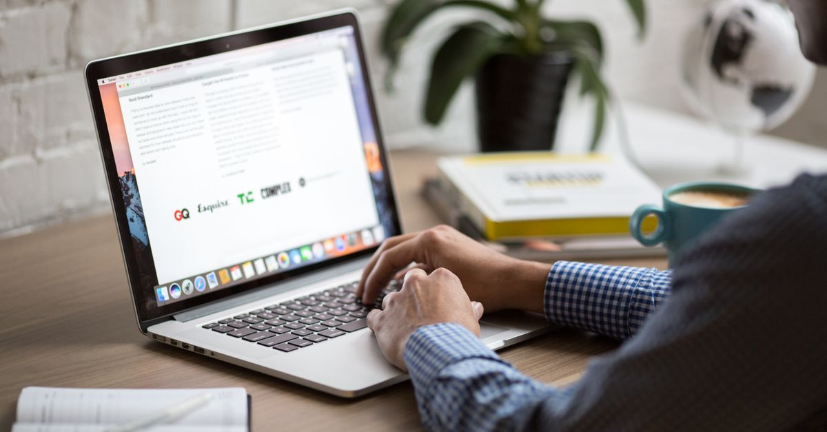 Content writer typing a blog post informed by competitor keyword research